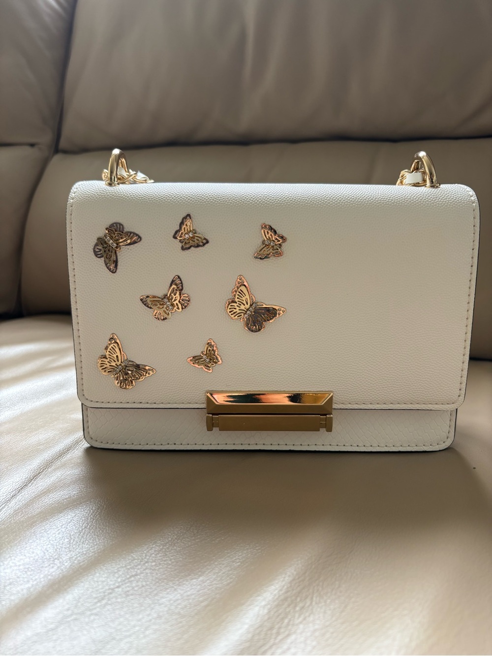White Aldo Shoulder Bag with Gold Butterfly Accents